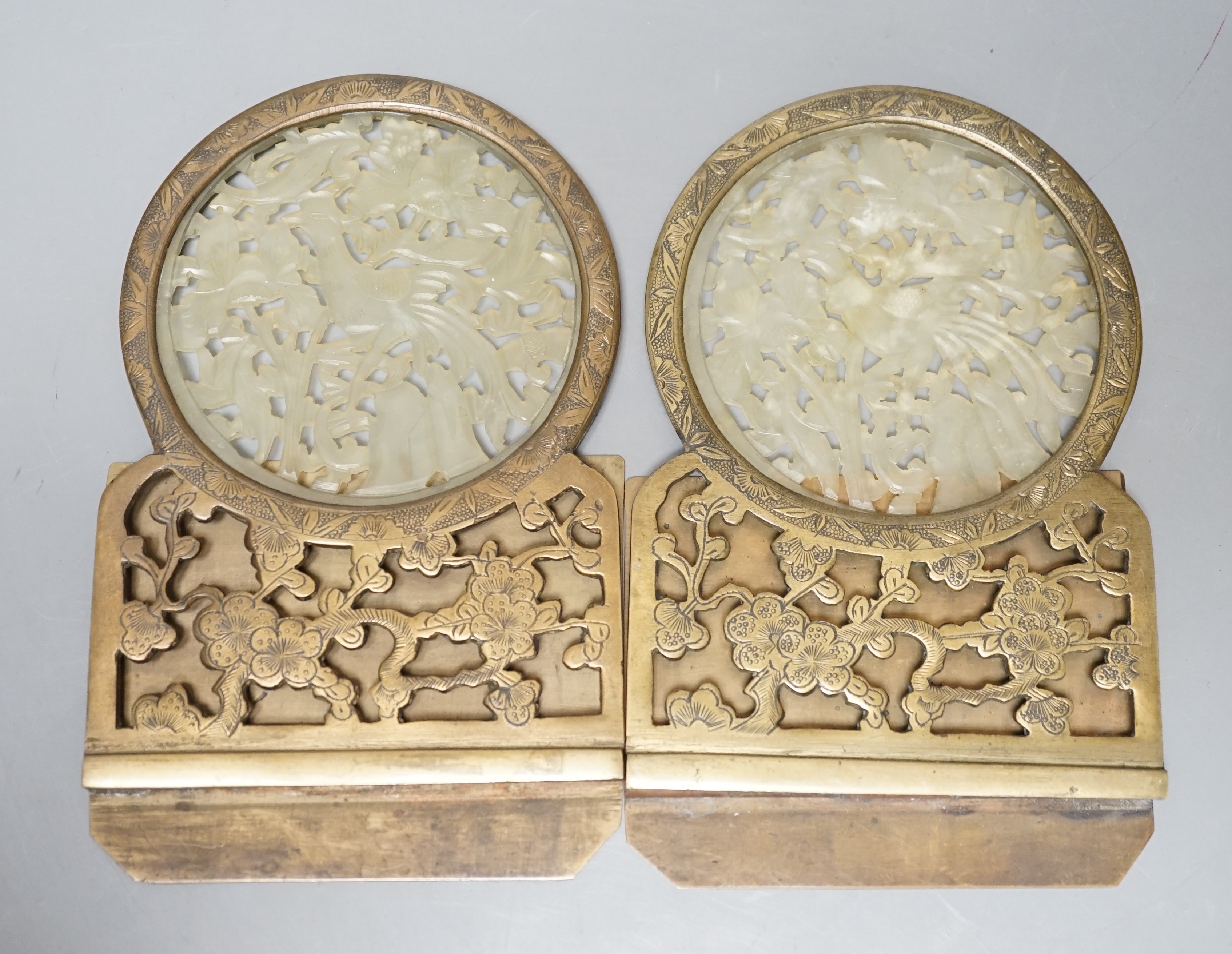 A pair of early 20th century Chinese bowenite jade mounted brass bookends 16cm tall